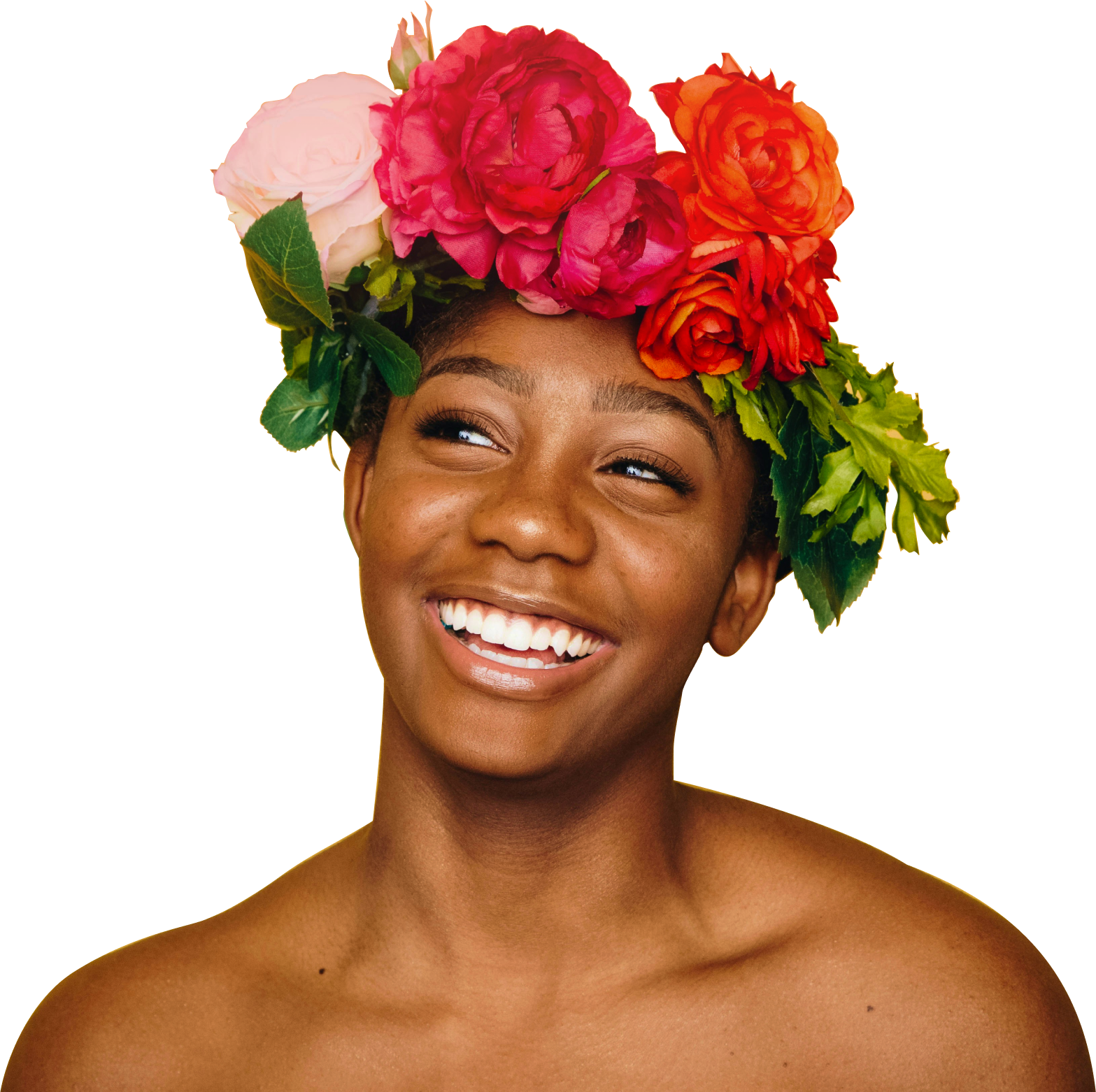 A woman smiling with flowers in her hair
